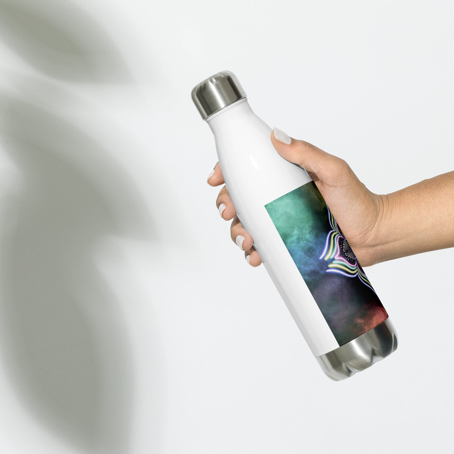 Starglow Lotus water bottle being held in hand – glowing visionary design