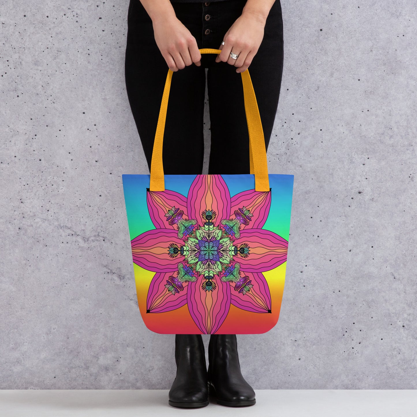Woman carrying BarbArt’s psychedelic tote bag with colorful sacred flower print