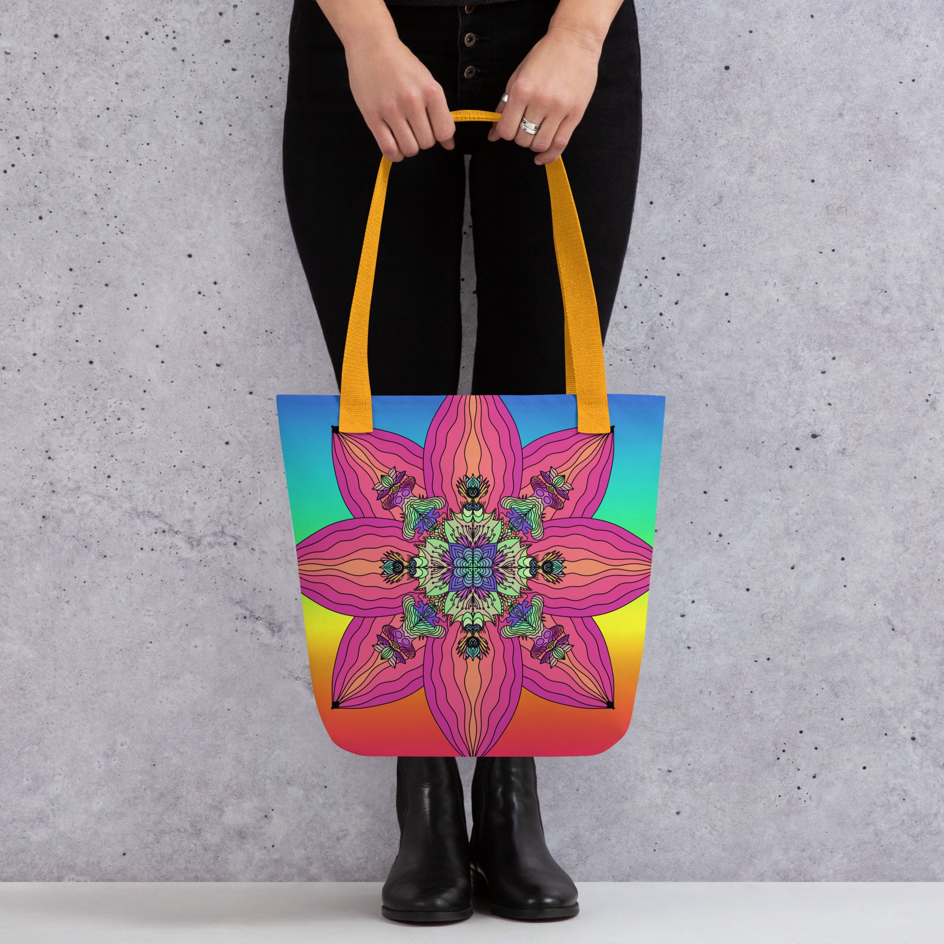 Woman carrying BarbArt’s psychedelic tote bag with colorful sacred flower print