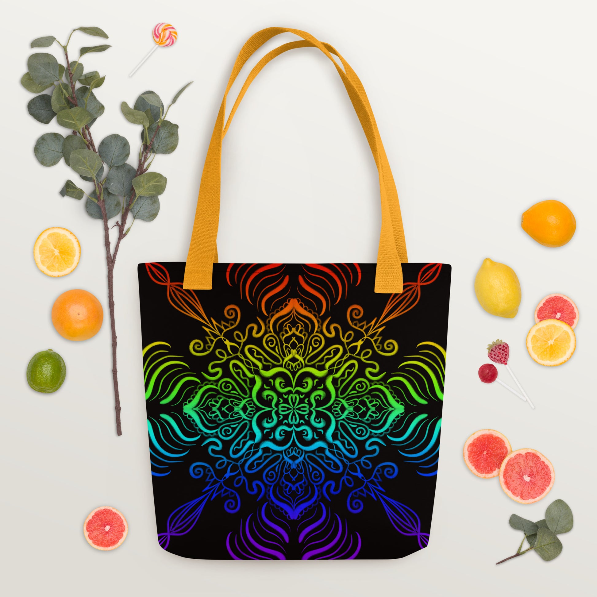 Flat lay of the Elemental Harmony tote bag with vibrant fruits and flowers