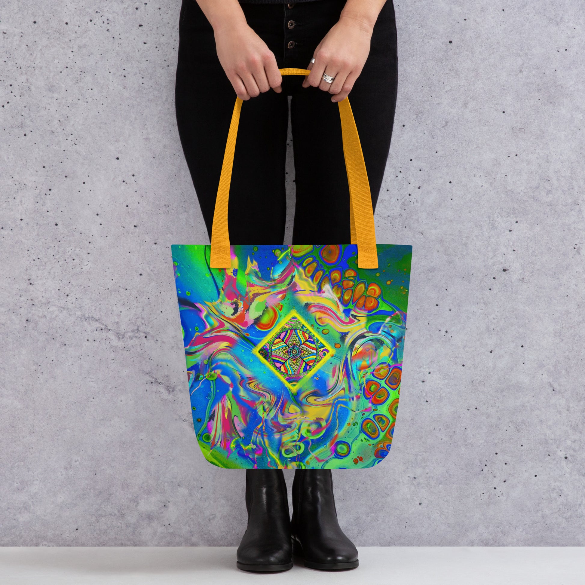 Front view of woman holding Quantum Nectar tote – trippy and colorful design