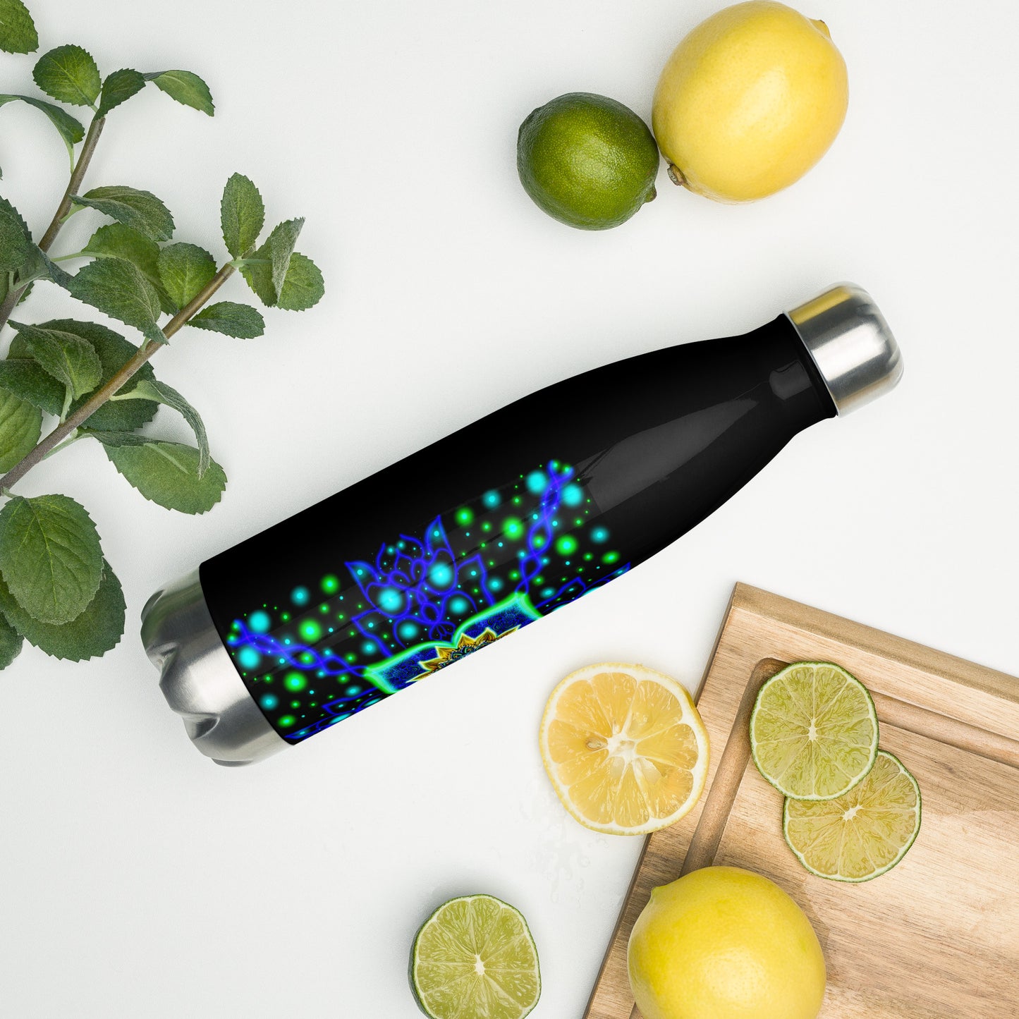 Quantum Pulse stainless steel bottle surrounded by lemons and mint on a white background
